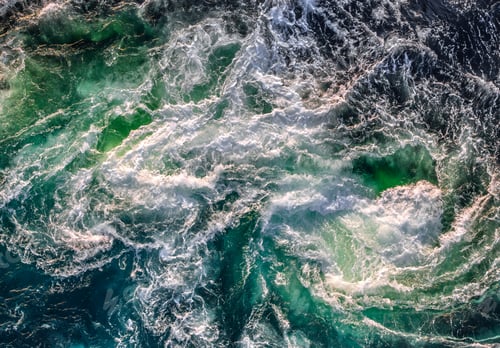 Preview: Blue waves of water of the river and the sea meet each other during high tide and low tide.