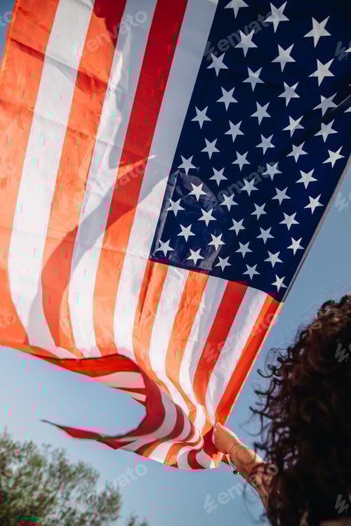 Preview: Girl with an American flag. Independence Day concept