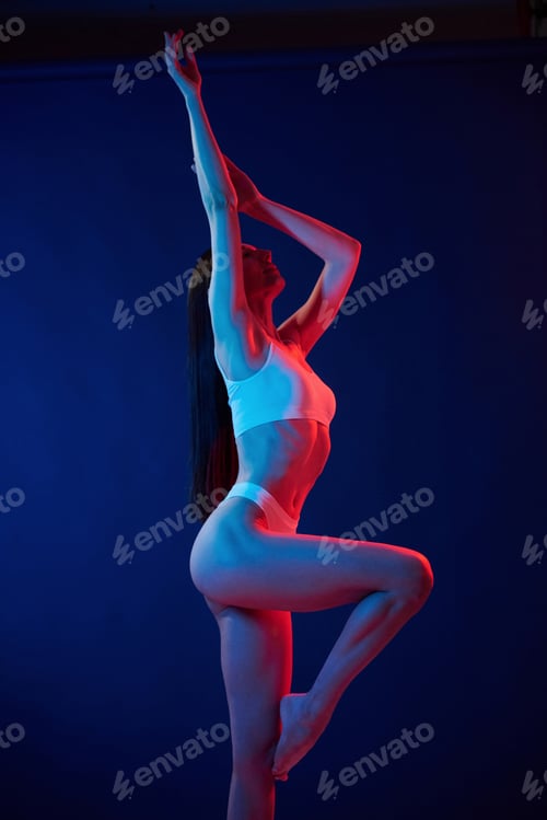 Preview: Diferent poses. Young woman in underwear is in the studio with neon lights