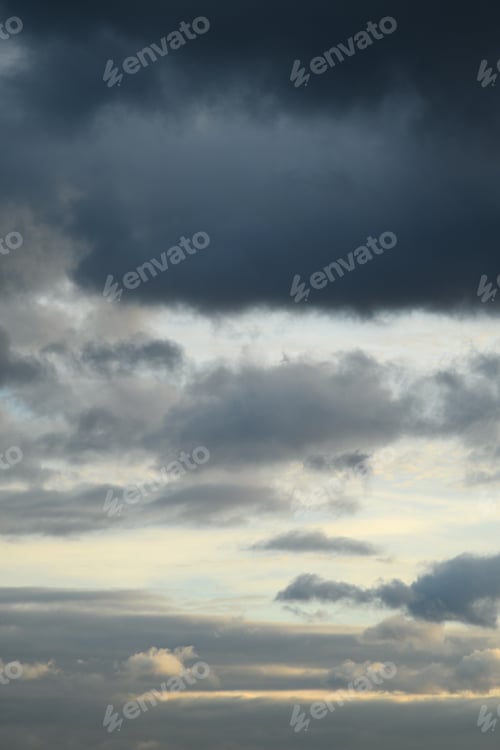 Preview: Vertical photo of blue clouds in cloudy weather. Aesthetic neutral photo.