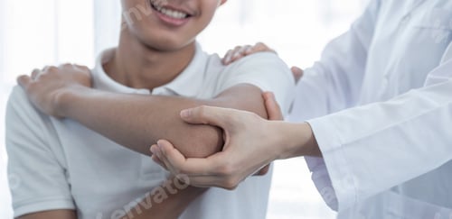 Preview: Female doctor hand doing physical therapy By extending the shoulder of a male patient