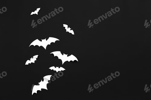 Preview: halloween and decoration concept - paper bats flying
