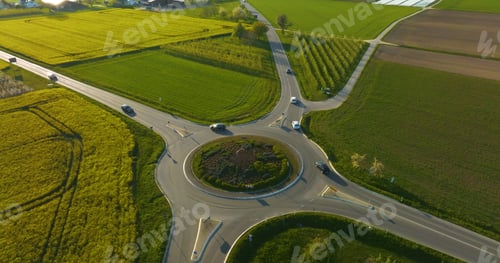 Preview: Roundabout with cars surrounded by greenery in Germany