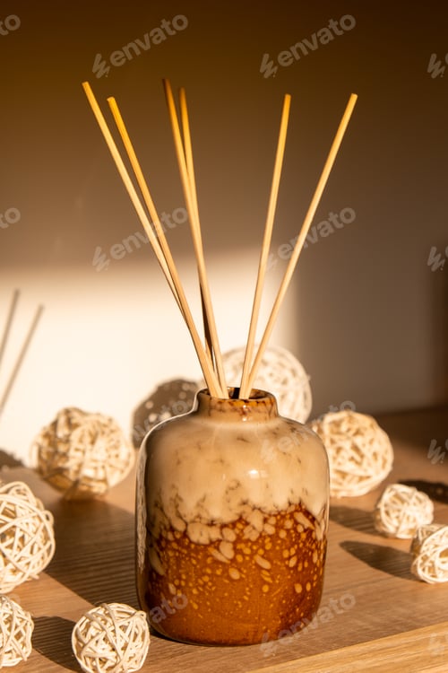 Preview: Cozy home decorations aroma reed diffuser in the living room. Home comfort concept. Bottle container