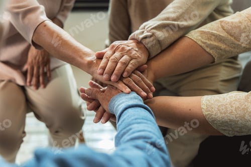 Preview: Group of Asian elderly people joining hands together