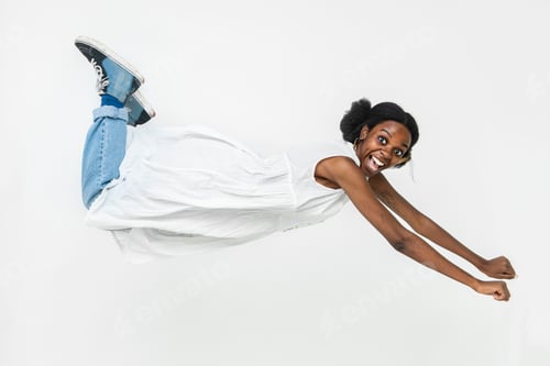 Preview: Playful African American woman flying