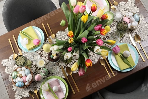 Preview: Festive table setting with beautiful flowers, top view. Easter celebration