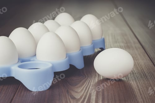 Preview: eggs on the brown wooden table