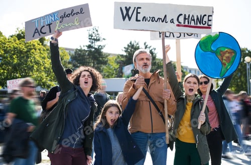Preview: People with placards and posters on global strike for climate change, shouting.