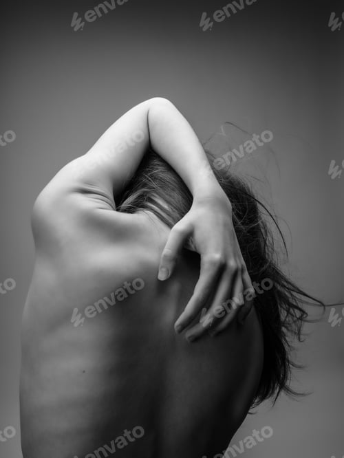Preview: woman holding hands on her back rear view black and white photo