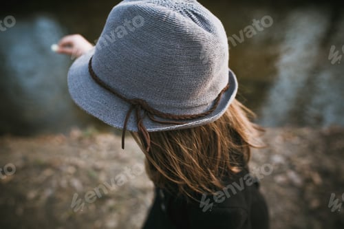 Preview: little girl in a black coat and hat
