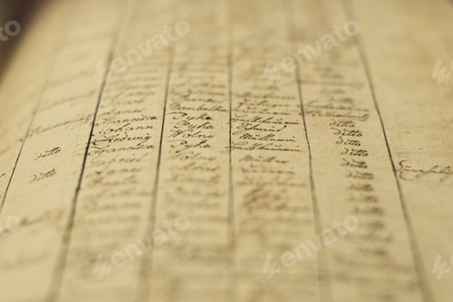 Preview: Soft focus of an old book of local records with list of residents' names and information