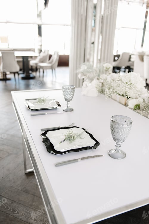 Preview: Table and tablecloth decoration, beautiful plates and glasses. Wedding, holiday or dinner party.