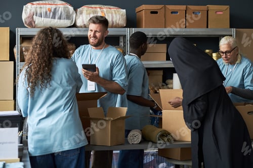 Preview: Organizing Donations at Community Center With Volunteers