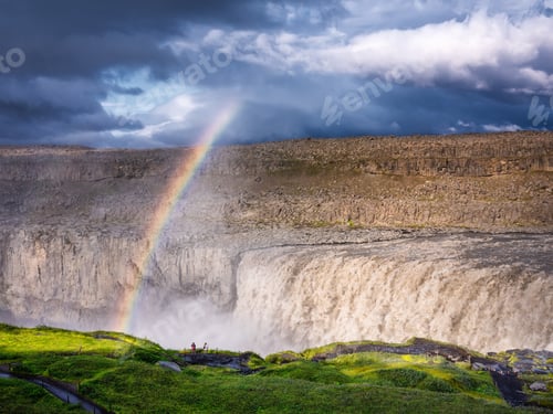 Preview: Dettifoss waterfall and rainbow, Iceland. Famous place in Iceland. A mountain valley and clouds.