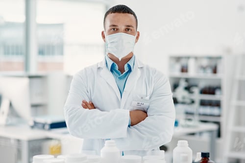 Preview: Portrait of a confident young scientist wearing a mask in a modern laboratory