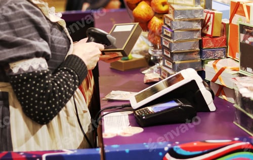 Preview: The seller scans the barcode of the goods from the store. Payment by cash register.