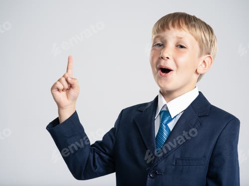 Preview: Photo of a businessman boy pointing finger up.