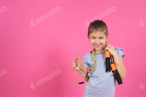 Preview: Cute girl with jump rope on color background. Space for text