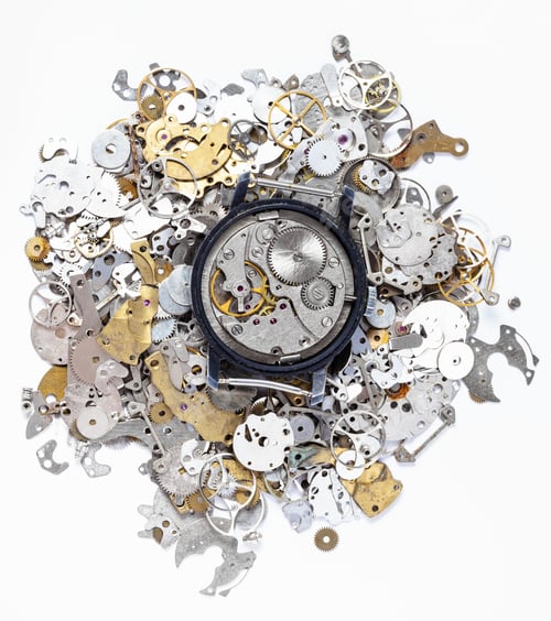 Preview: top view of mechanic watch on heap of spare parts