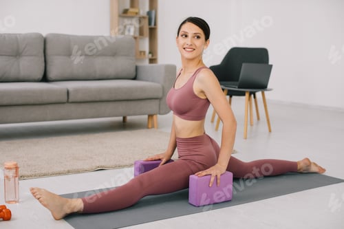Preview: Attractive and healthy young woman sat down on the twine at home