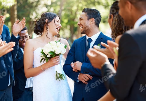 Preview: Happy bride and groom laughing and looking joyful after wedding ceremony and ready to celebrate wit