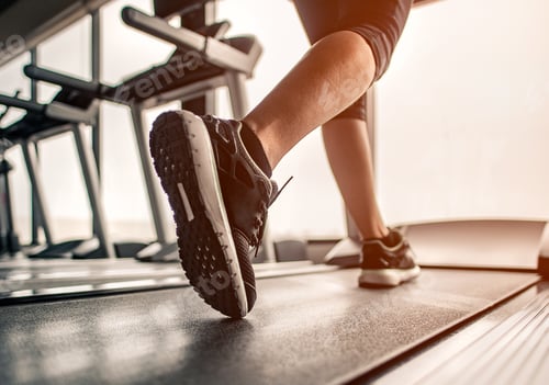Preview: Close up on shoe,Women running in a gym on a treadmill.exercising concept.fitness and healthy lifest