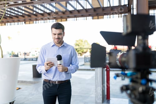 Preview: TV Reporter Reading Questions At Broadcast