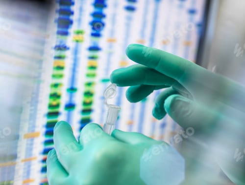 Preview: Scientist examining a sample in a lab with DNA sequencing gel in the background.