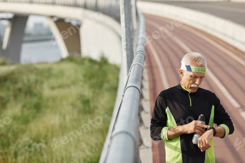 Preview: Sporty Aged Man Checking Time