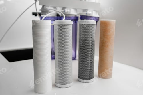 Preview: Four filters for the purification system of water on the table in the kitchen.