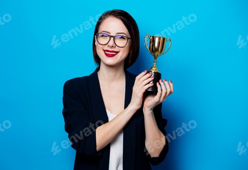 Preview: young smiling woman with cup trophy