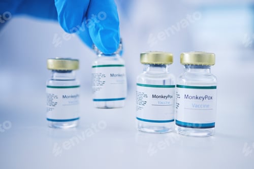Preview: Vaccine, doctor hands and monkeypox vial for safety, healthcare medicine and pharmaceutical laborat