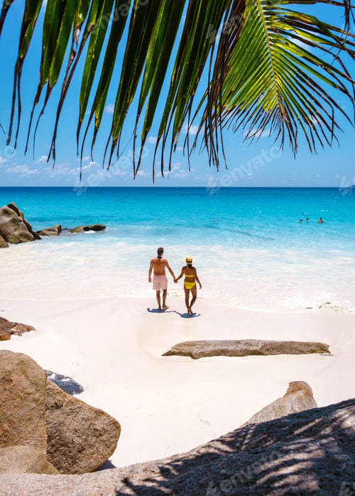 Preview: Anse Georgette Praslin Seychelles, young couple men and woman on a tropical beach