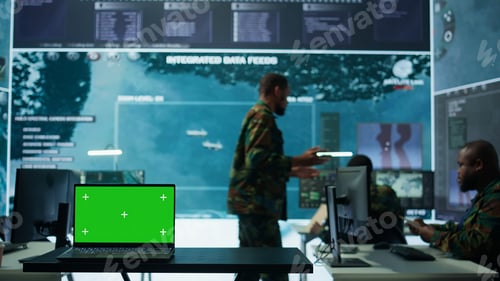 Preview: Military IT specialist in command center working on collecting field data