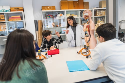 Preview: Students learning anatomy with teacher and anatomical model in science class