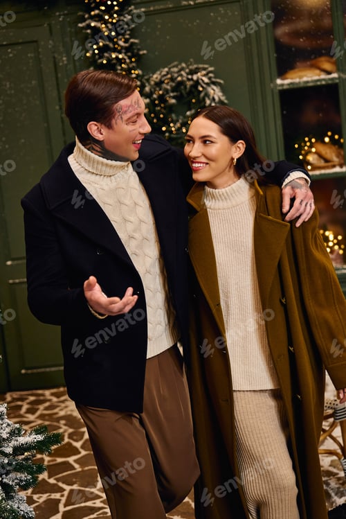 Preview: Young couple enjoys a cozy moment together during winter holiday festivities