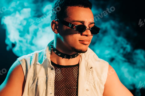 Preview: Stylish Man Dressed In Net In Neon Light, Smoke Studio Or In Night Club