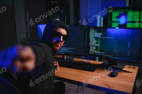 Preview: Wanted hackers coding virus ransomware using laptops and computers.