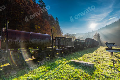 Preview: Sun rays and flare at misty morning in abandoned railway station
