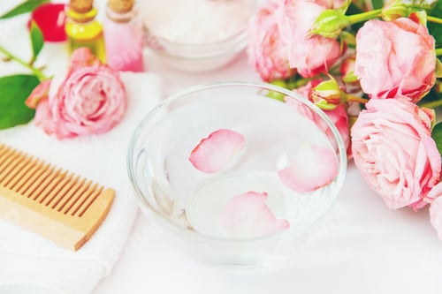 Preview: cosmetics with rose flower extract. Selective focus.