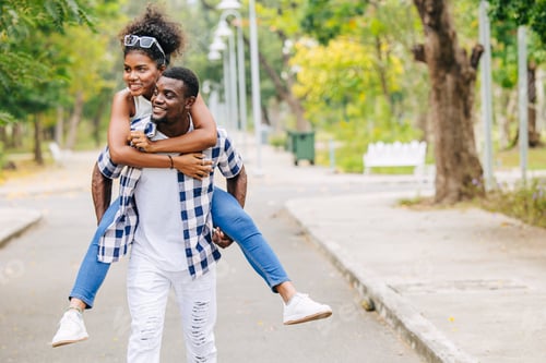 Preview: Man and women Date couple in valentine day. African black lover at green park outdoors summer