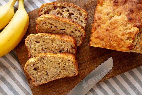 Preview: Homemade Banana Bread on a wooden board, top view. Close-up.