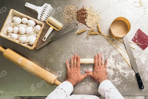 Preview: Baker kneading dough in a bakery.