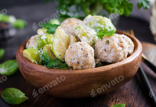 Preview: Brussels sprouts roasted with chicken meatballs and onions in a creamy sauce.