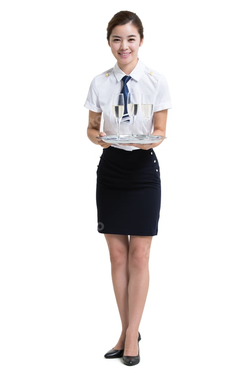 Preview: Woman Holding Tray of Champagne Glasses Smiling