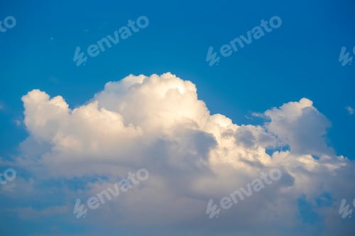Preview: Puffy clouds on the blue sky with copy space on top of the frame