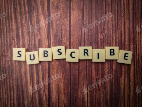 Preview: Toys word arranged on a wooden background with the arrangement of the word SUBSCRIBE
