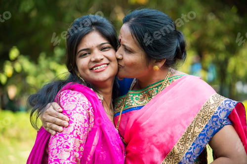 Preview: Portrait of happy mother and daughter embracing.