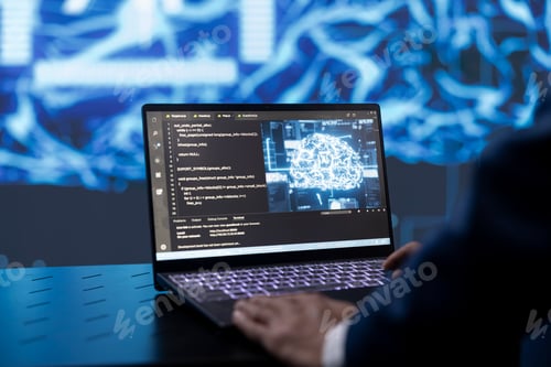 Preview: Close up shot of employee at work using machine learning on notebook